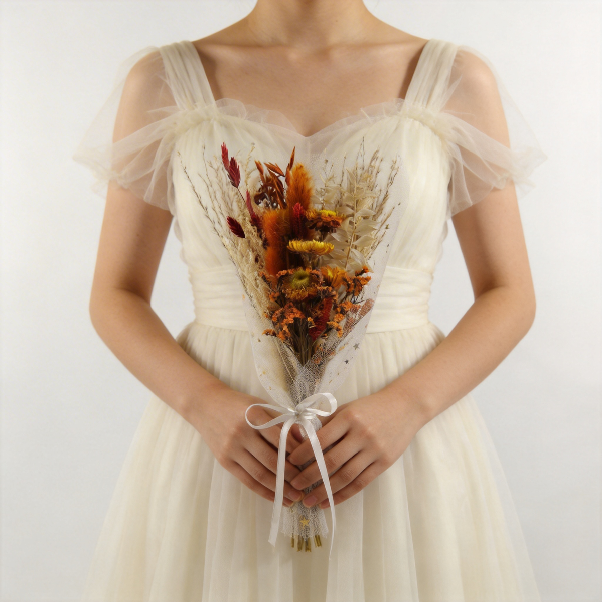 Copper and amber dried bouquet with pampas, wrapped in sheer white tulle