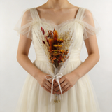 Copper and amber dried bouquet with pampas, wrapped in sheer white tulle