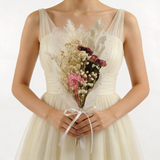 Ivory dried bouquet with pink and wine accents, wrapped in sheer white tulle